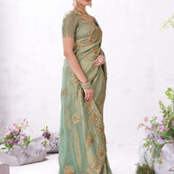 Green embroidered saree elegant look
