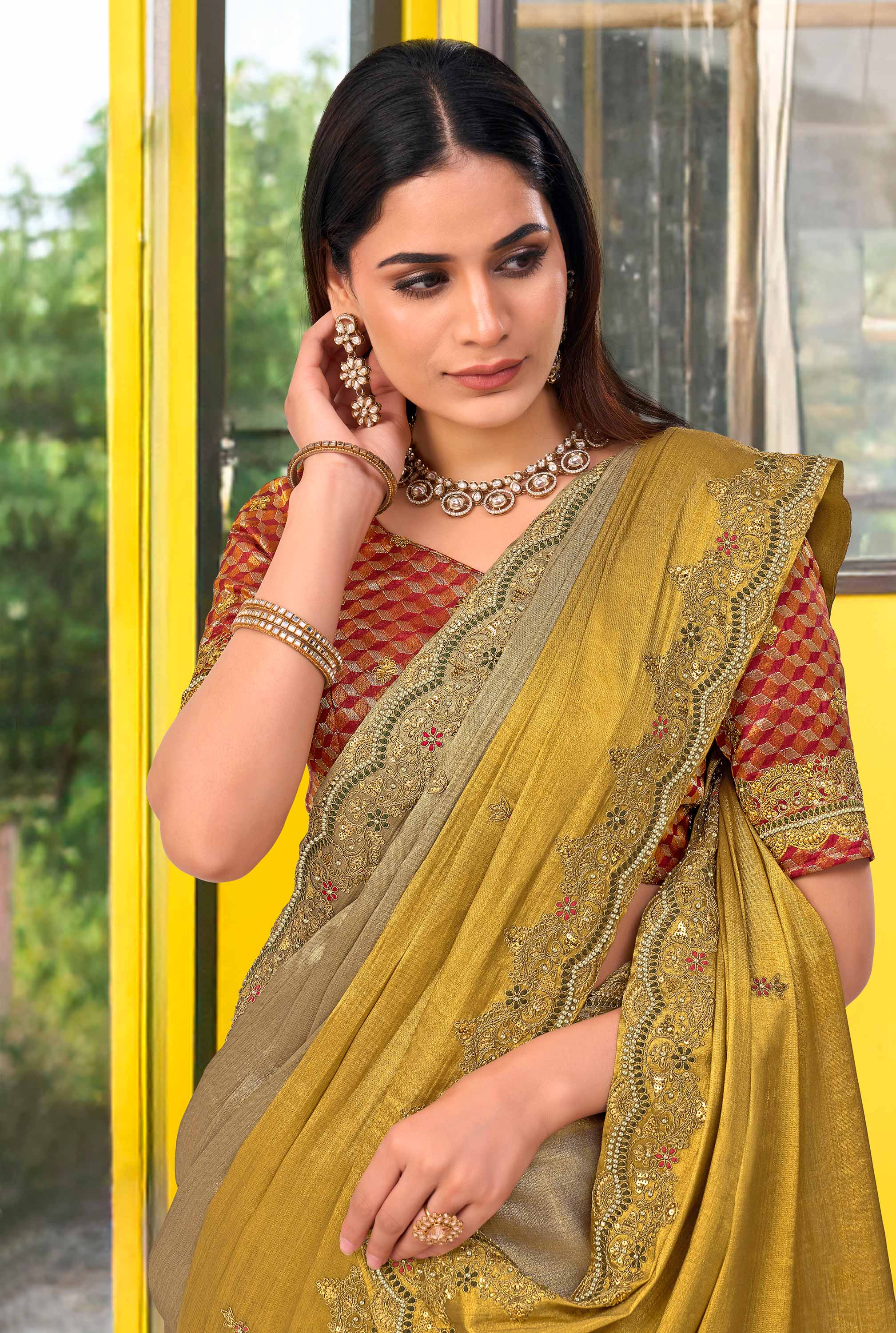 Brown silk blend floral embroidered border saree
