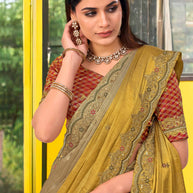 Brown silk blend floral embroidered border saree
