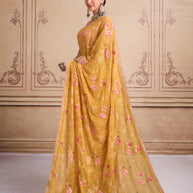 Yellow embroidered tissue organza saree wedding wear