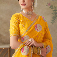 Yellow embroidered chiffon saree festive wear