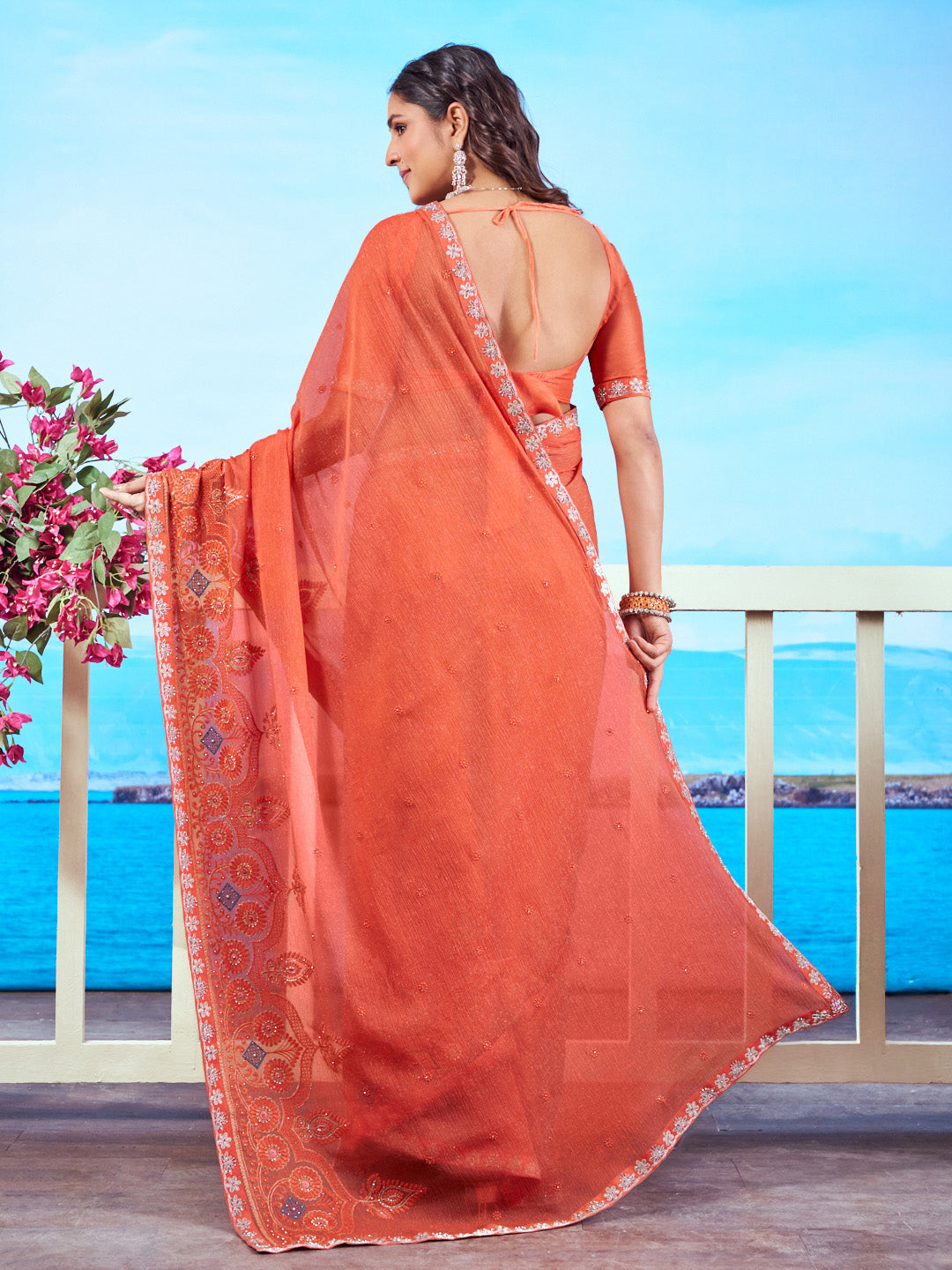 Orange silver embroidered chiffon saree occasion wear