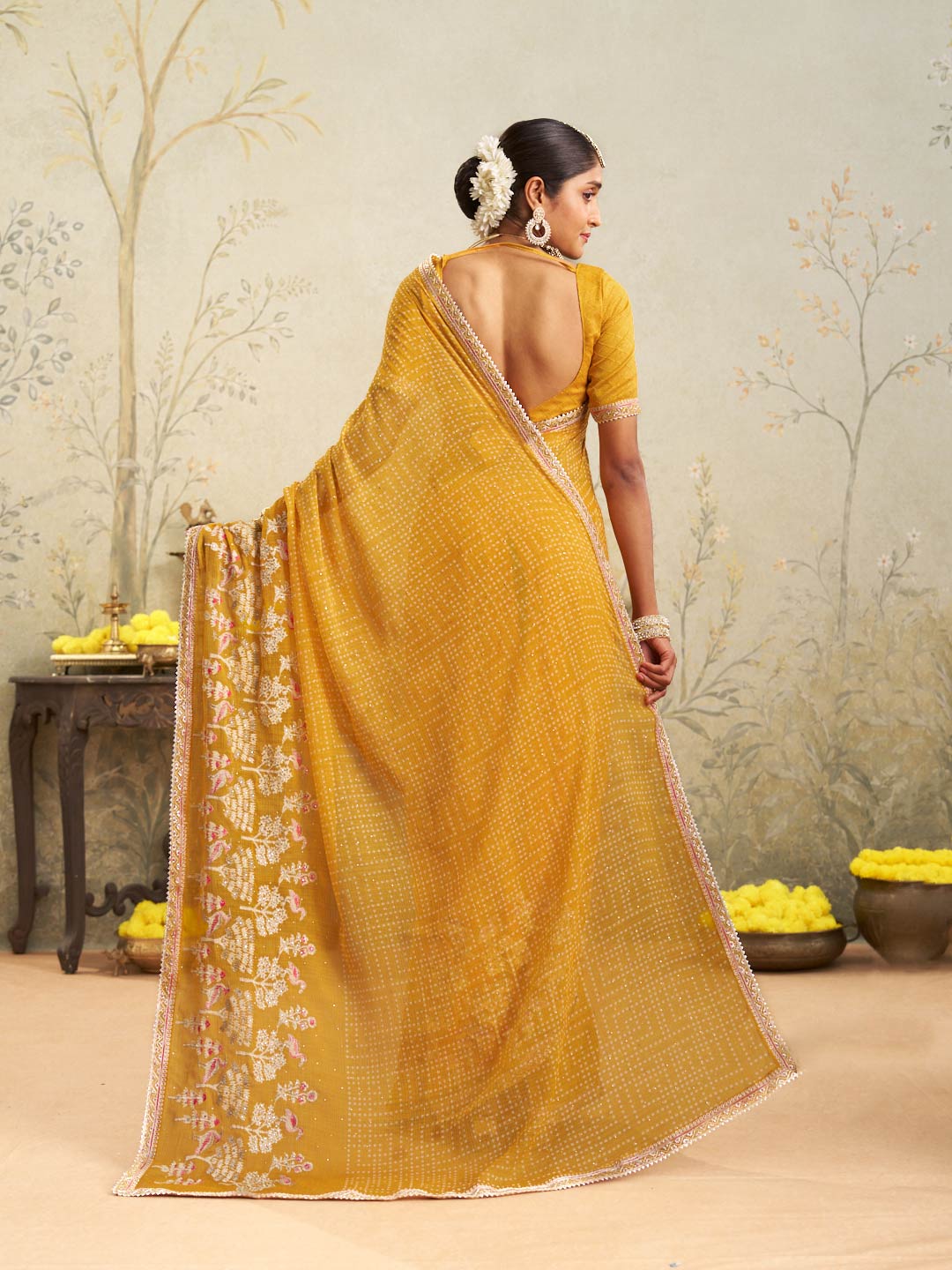 Yellow embroidered chiffon saree party wear