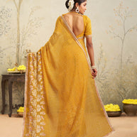 Yellow embroidered chiffon saree party wear
