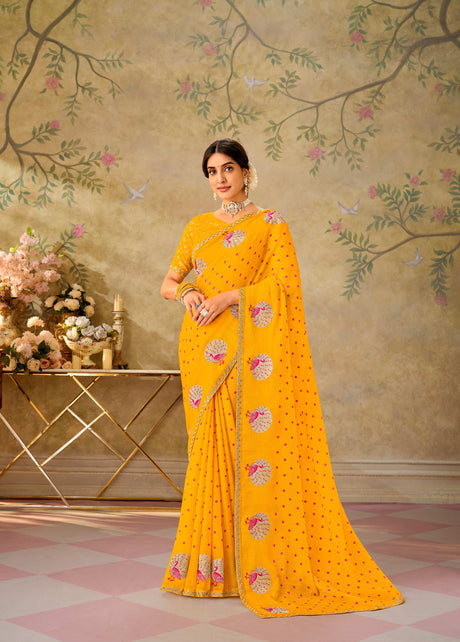 Yellow embroidered chiffon saree party wear