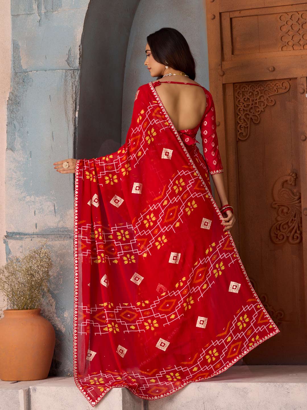 Red geometric printed georgette saree festive wear