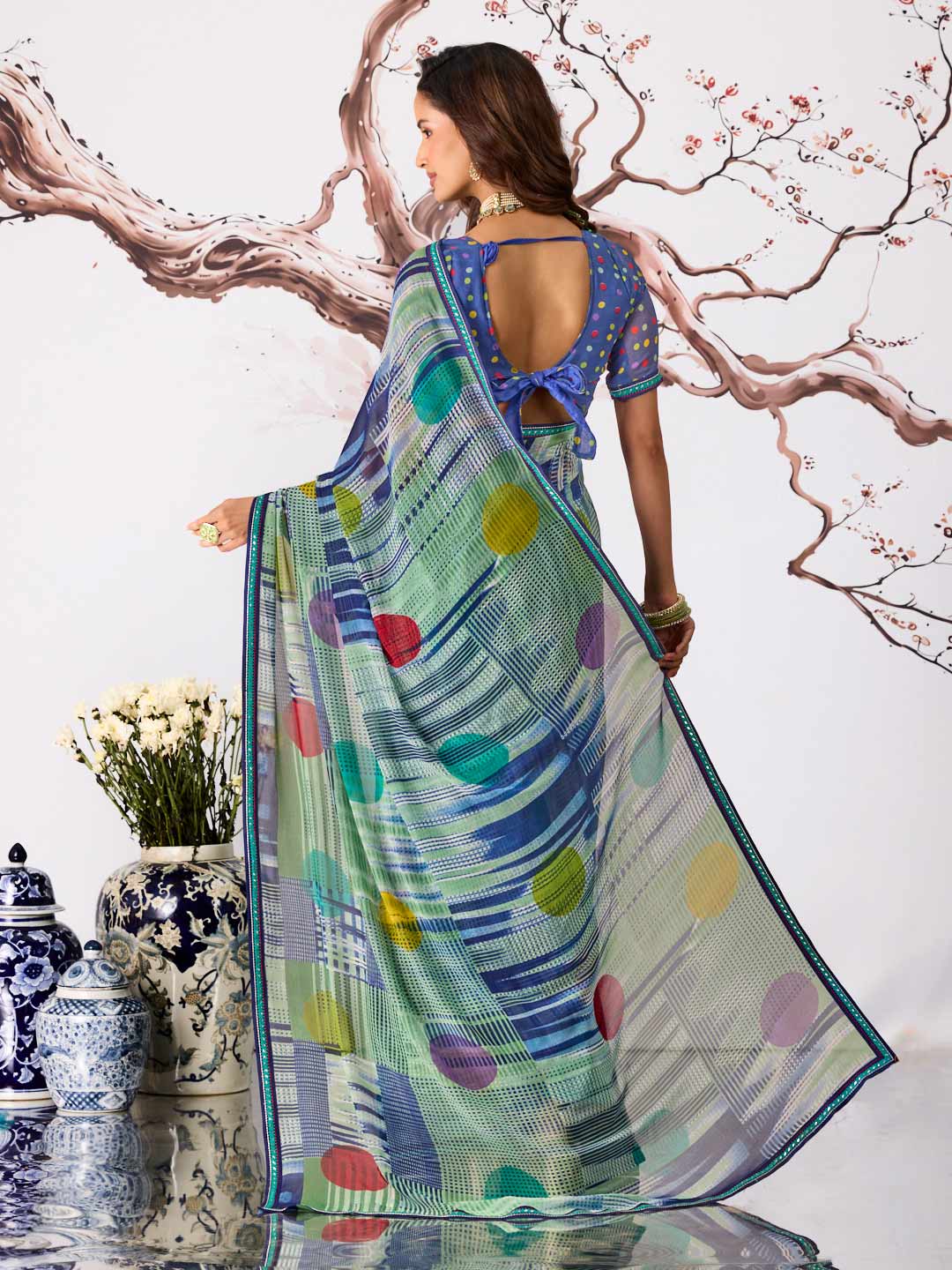 Blue polka dot printed georgette saree festive wear
