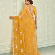 Yellow embroidered chiffon saree daily wear