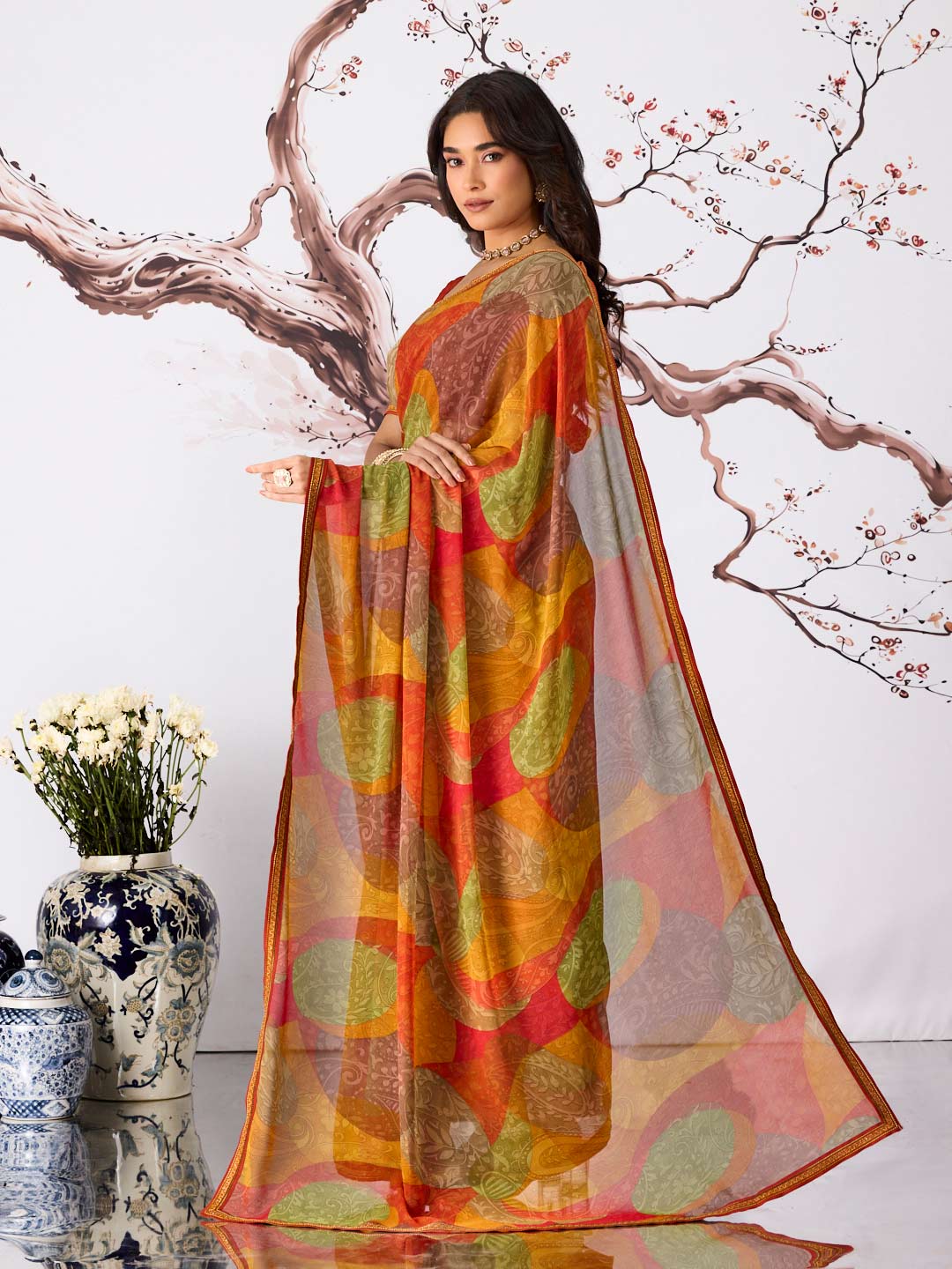 Orange abstract motif printed georgette saree festive wear