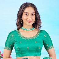 Green gold embroidered chiffon saree elegant wear