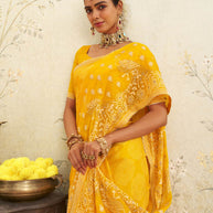 Yellow embroidered chiffon saree wedding wear