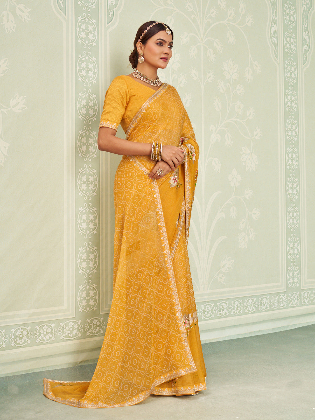 Yellow embroidered chiffon saree wedding wear