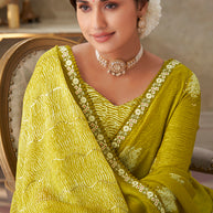 Green embroidered chiffon saree festive wear