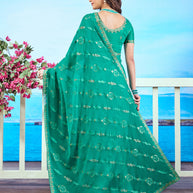 Green gold embroidered chiffon saree elegant wear