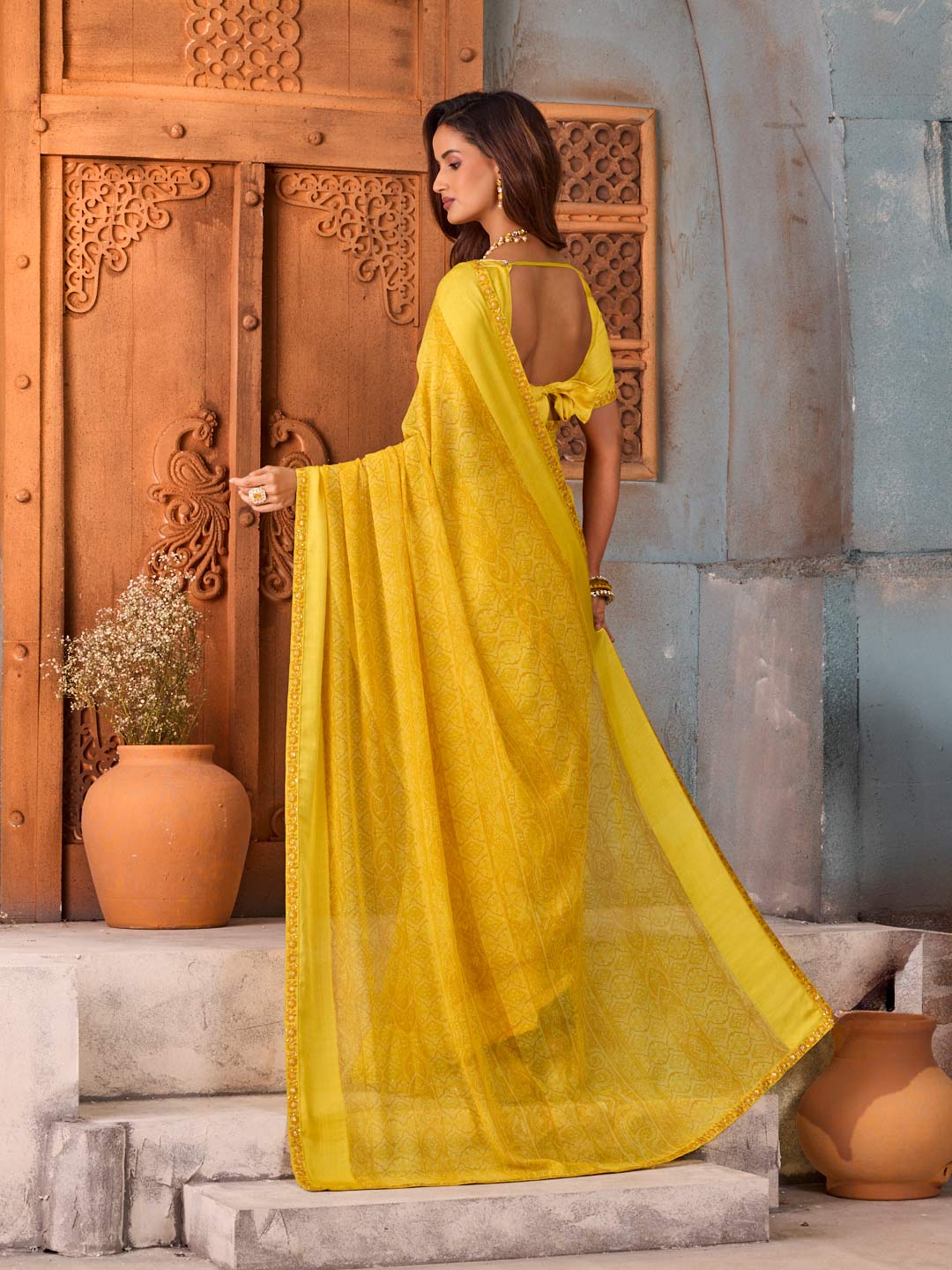 Yellow floral printed georgette saree daily wear