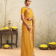 Yellow embroidered chiffon saree casual wear