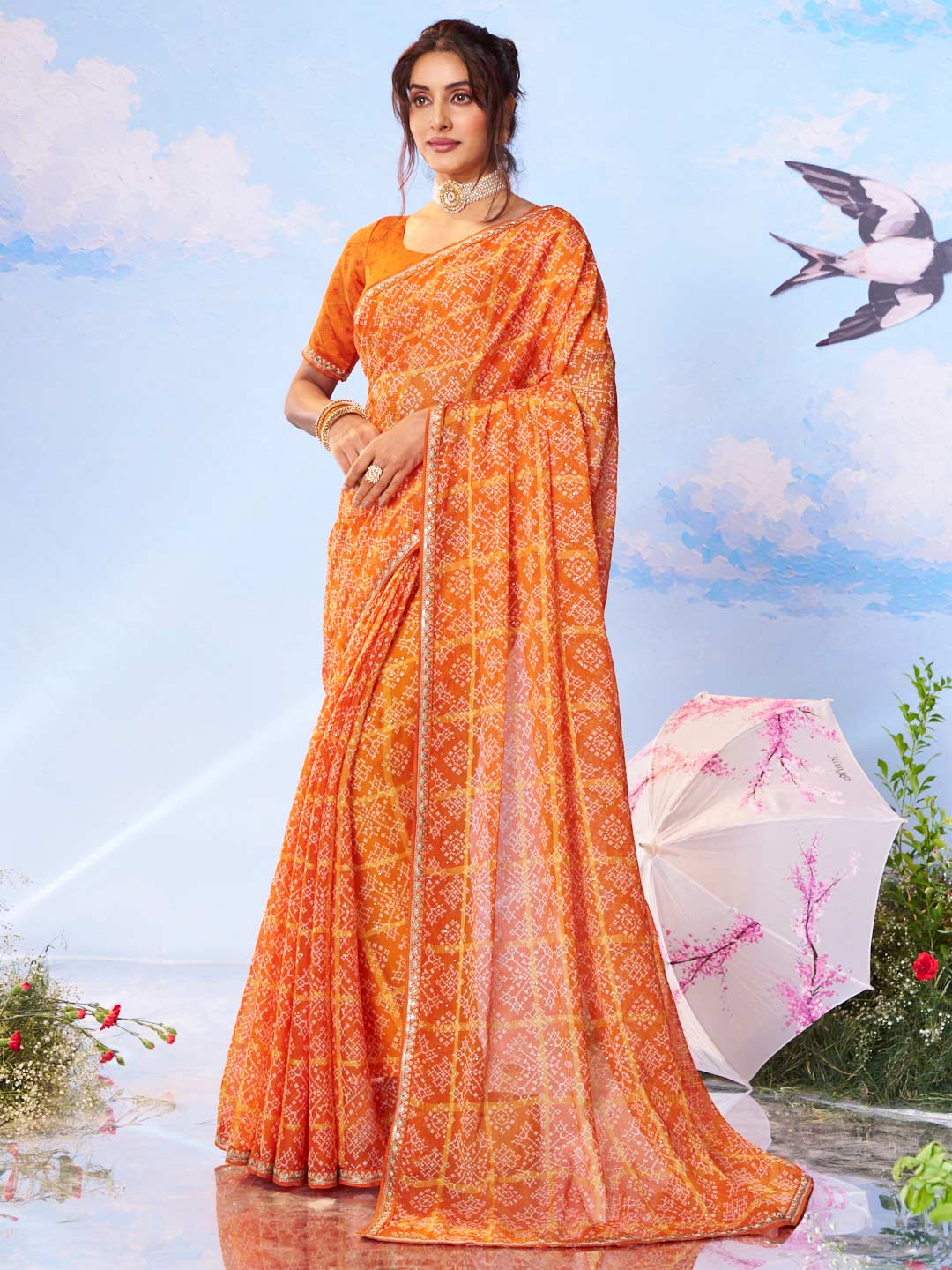 Orange floral printed silk saree festive wear