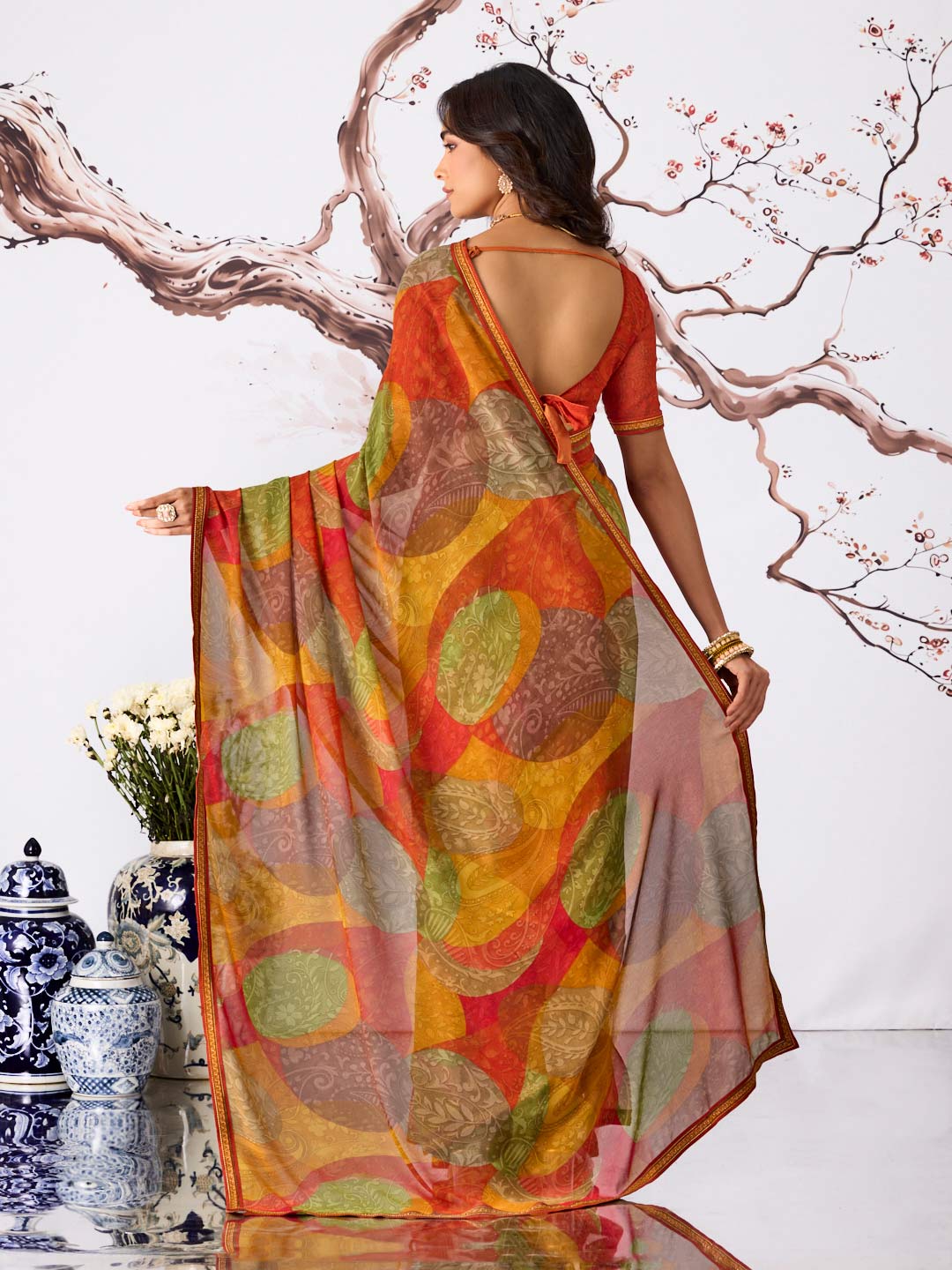Orange abstract printed georgette saree festive wear