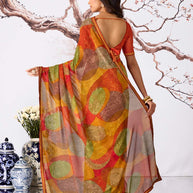 Orange abstract printed georgette saree festive wear