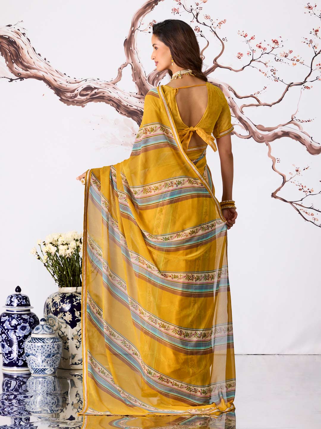Yellow striped printed georgette saree casual wear