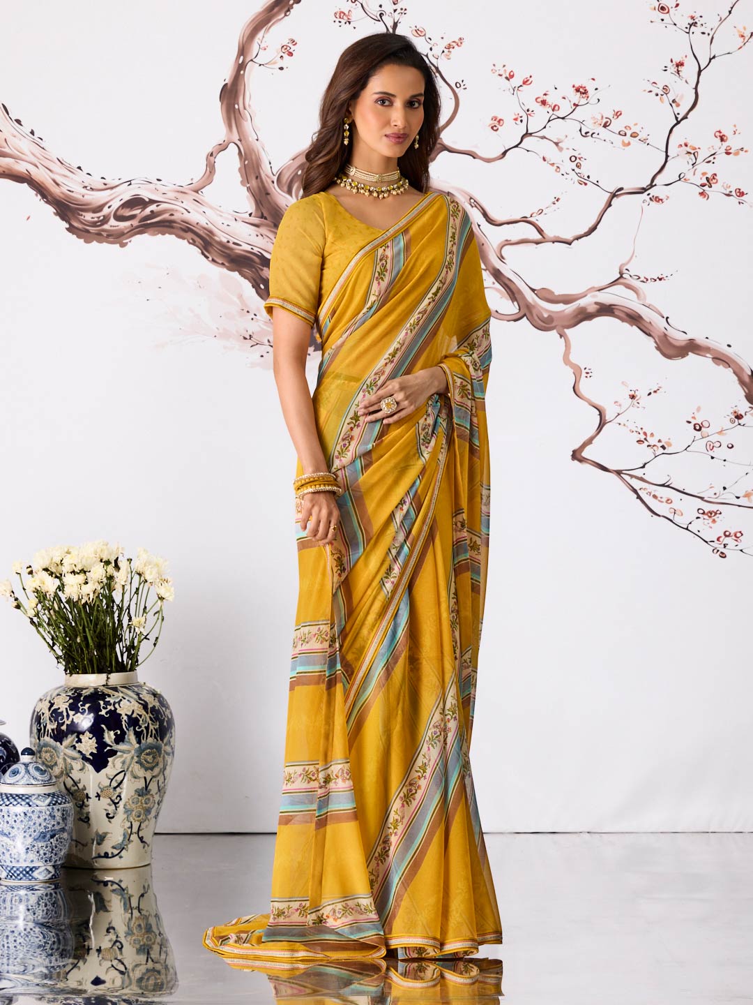 Yellow floral striped printed georgette saree festive wear