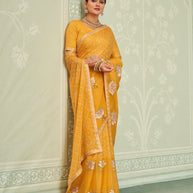 Yellow embroidered chiffon saree party wear