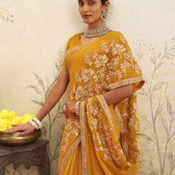 Yellow embroidered chiffon saree wedding wear