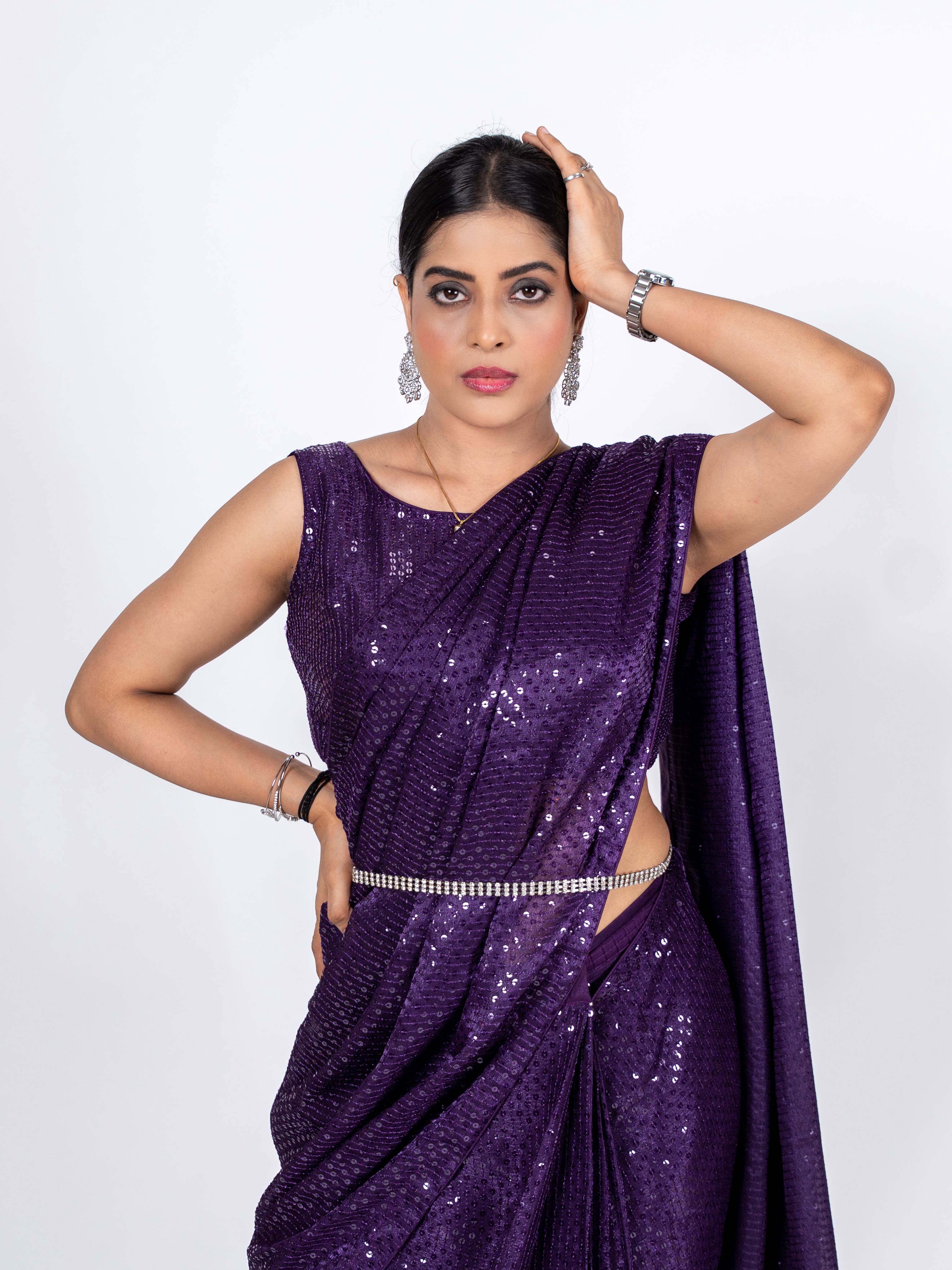 Purple sequin embroidered georgette saree wedding wear