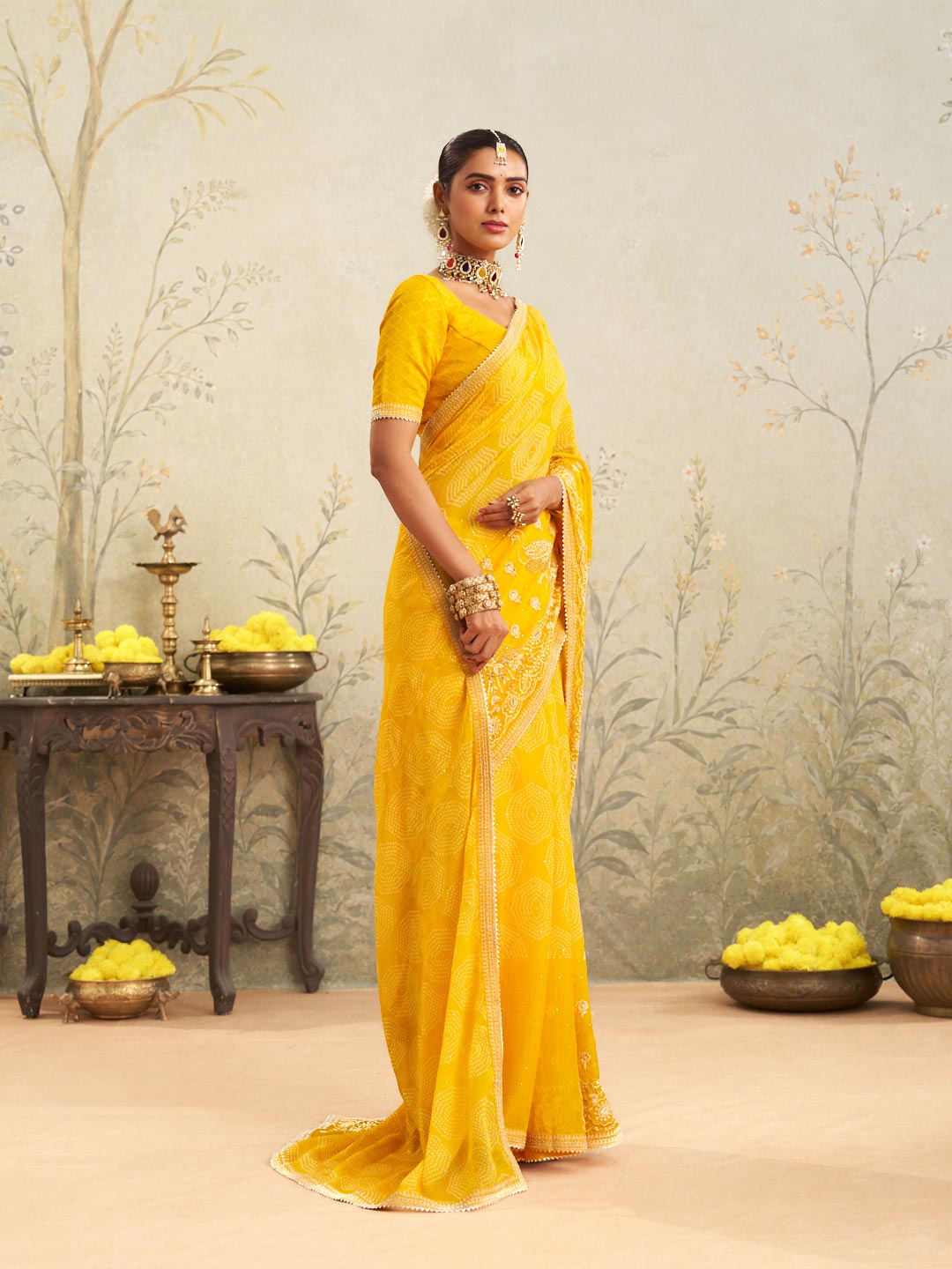Yellow embroidered chiffon saree casual wear