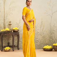 Yellow embroidered chiffon saree casual wear