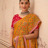 Orange floral embroidered chiffon saree wedding wear