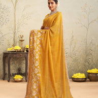 Yellow embroidered chiffon saree festive wear