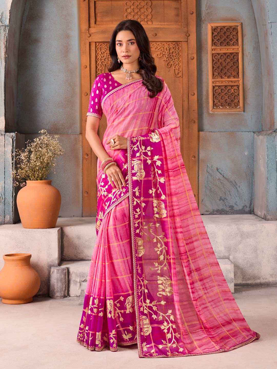 Pink zari embroidered chiffon saree festive wear