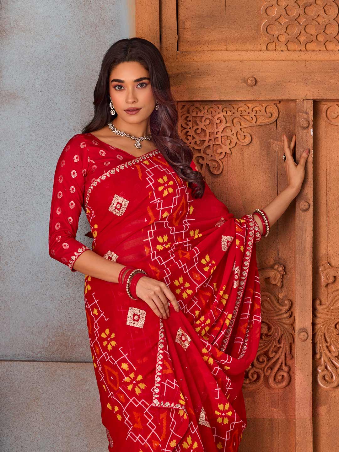 Red embellished printed georgette saree wedding wear