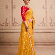 Orange floral embroidered chiffon saree wedding wear