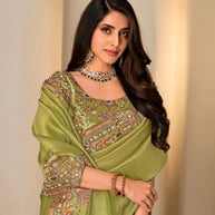 Green embroidered silk blend saree festive wear