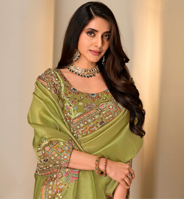 Green embroidered silk blend saree festive wear