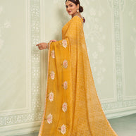 Yellow embroidered chiffon saree casual wear