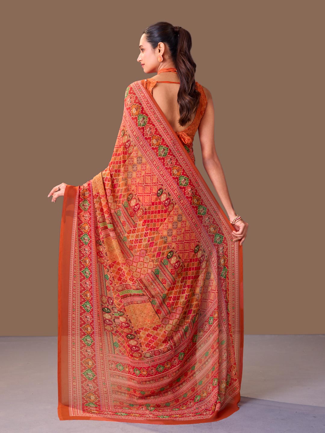 Laxmipati Dillagi Orange Georgette Floral Saree