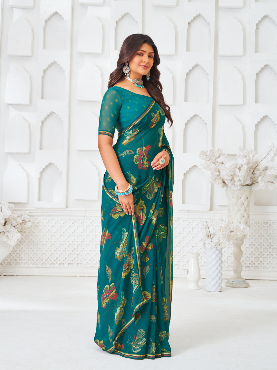 Laxmipati Kamya Teal Green Georgette Floral Printed Saree