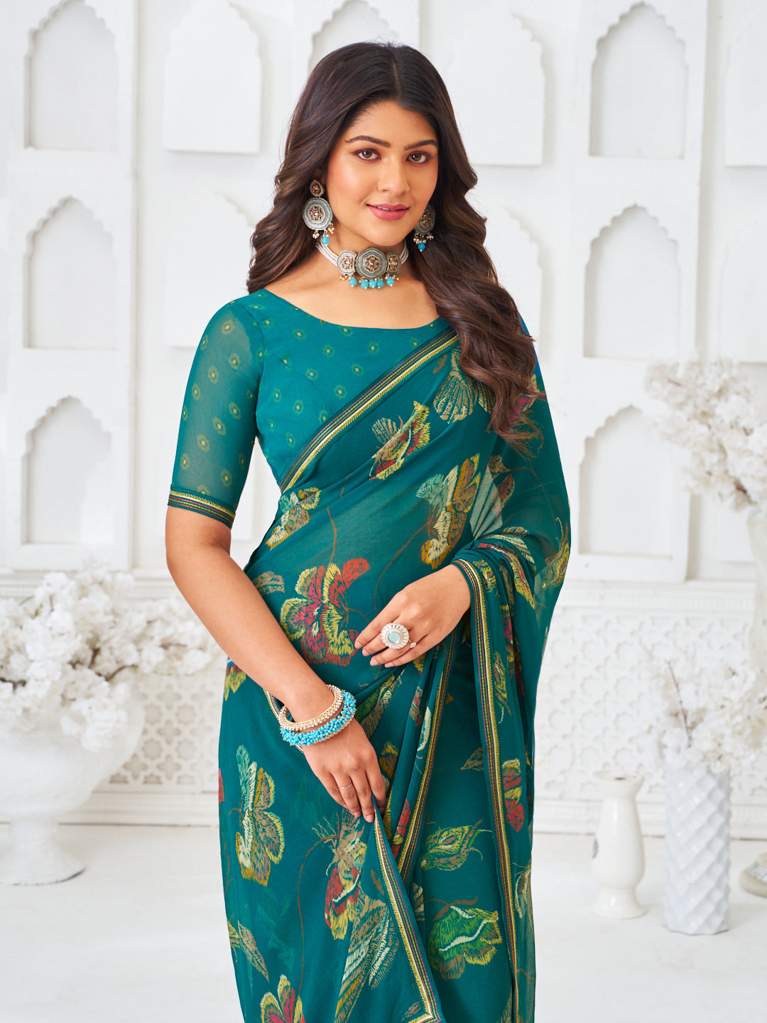 Laxmipati Kamya Teal Green Georgette Floral Printed Saree