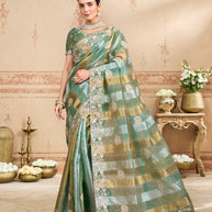 Green embroidered tissue organza saree festive wear