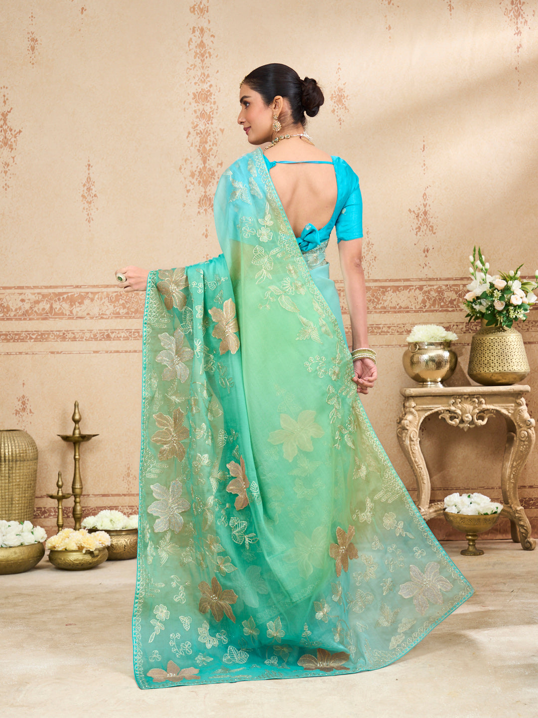Green embroidered tissue organza saree party wear