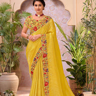 Yellow embroidered chiffon saree party wear