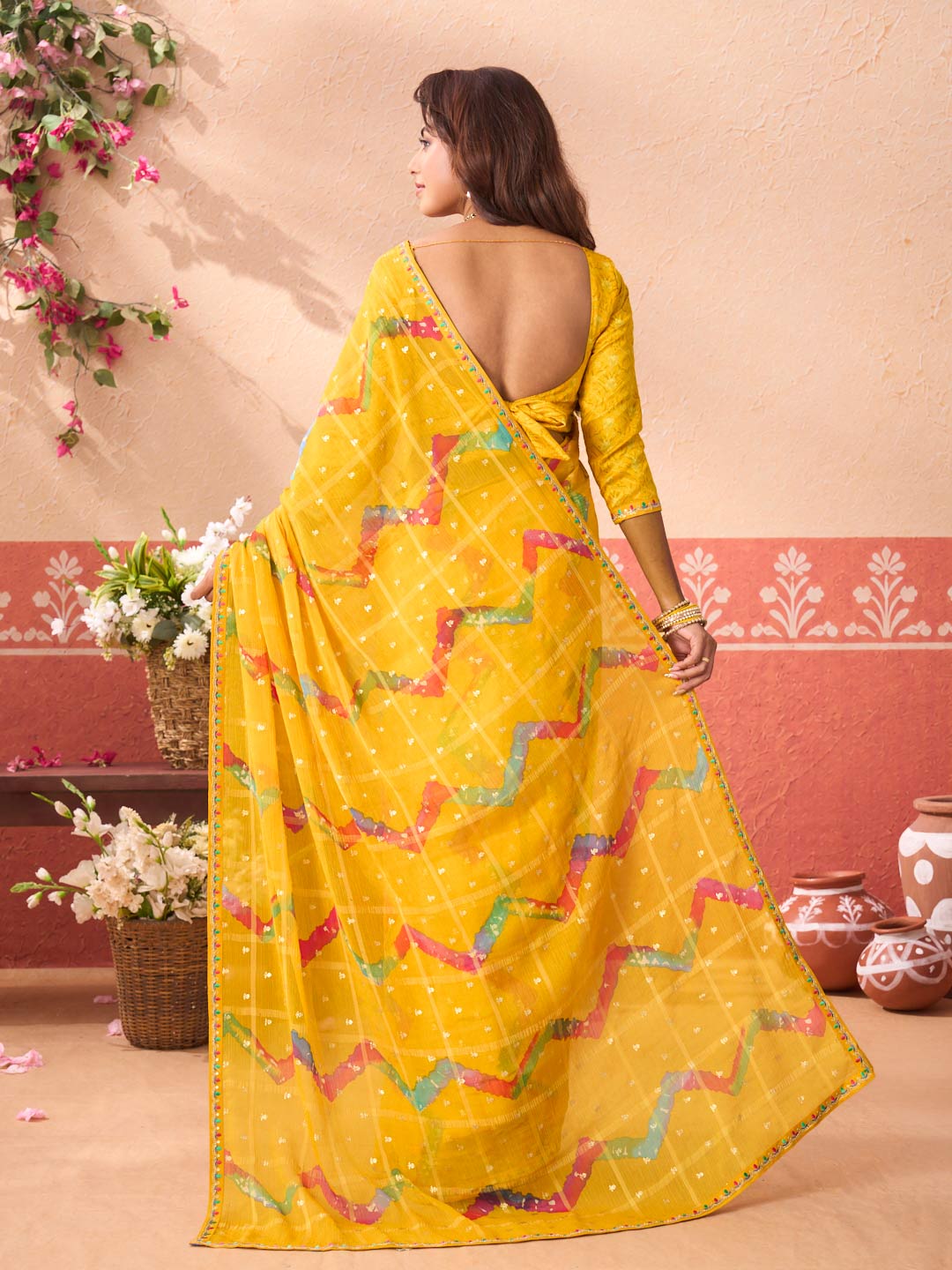Yellow geometric printed chiffon saree party wear
