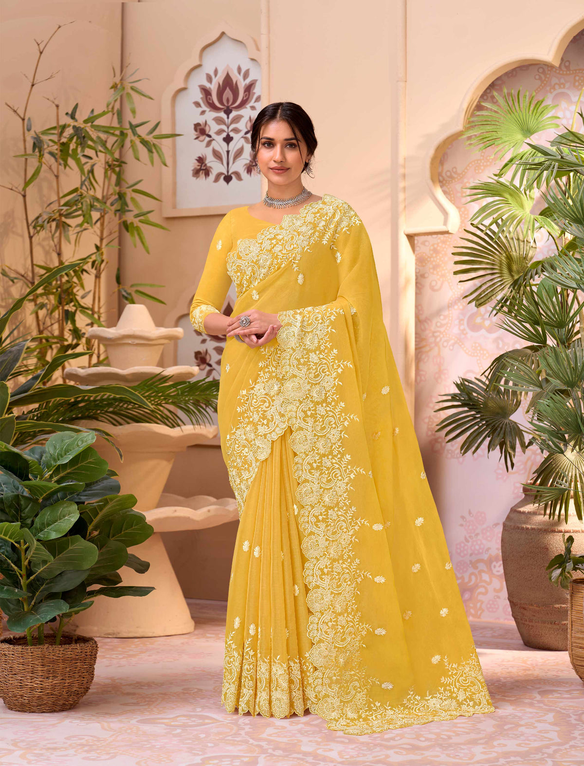 Yellow embroidered chiffon saree party wear