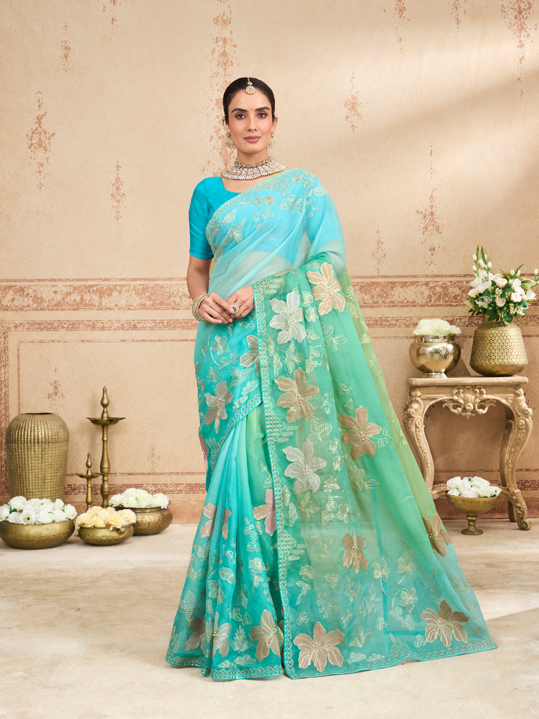 Green embroidered tissue organza saree festive wear