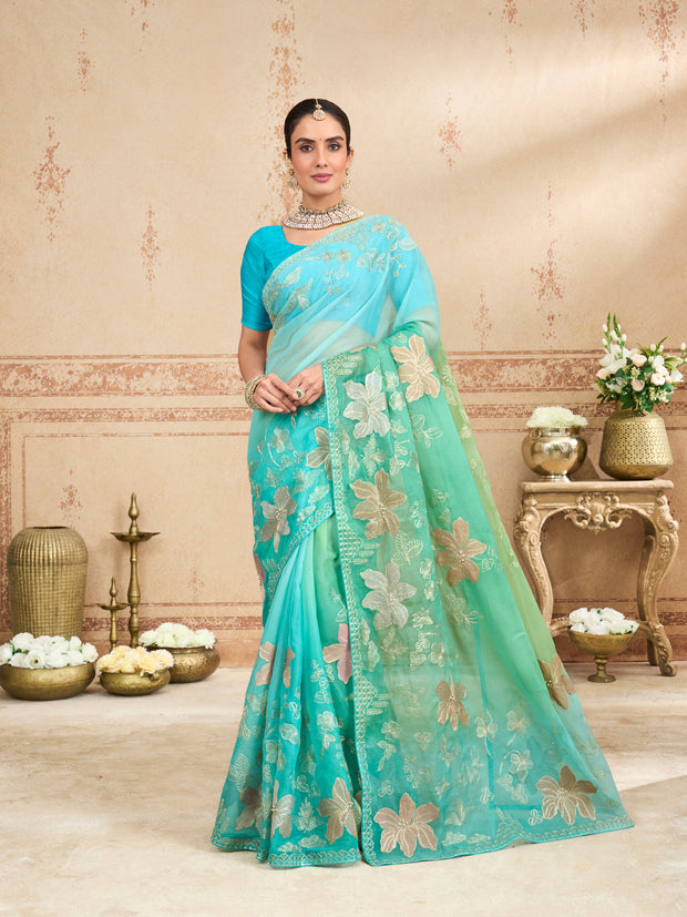 Green embroidered tissue organza saree festive wear
