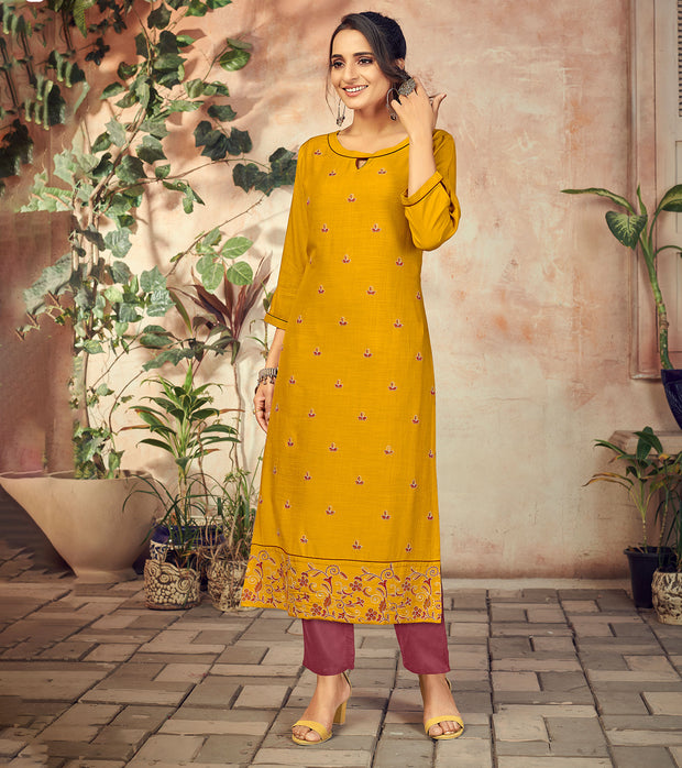 Laxmipati Rayon Tangerine Yellow Straight Cut Kurti Has Round Neck Variation , Embroidered Cufe &  Different Yoke Pattern