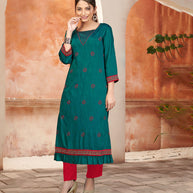 Laxmipati Bombay Velvet Peacock Green Straight Kurti Have Fancy Necklines With All Over Grading Embossed Buttas   & Laces Use Of Contrast Colour Effect, Along With Pant